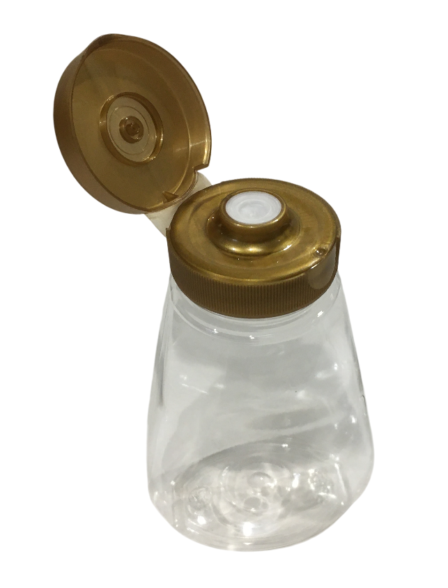 Vista dall alto del dosatore squeezer per miele in plastica alimentare con valvola antigoccia e tappo dorato aperto